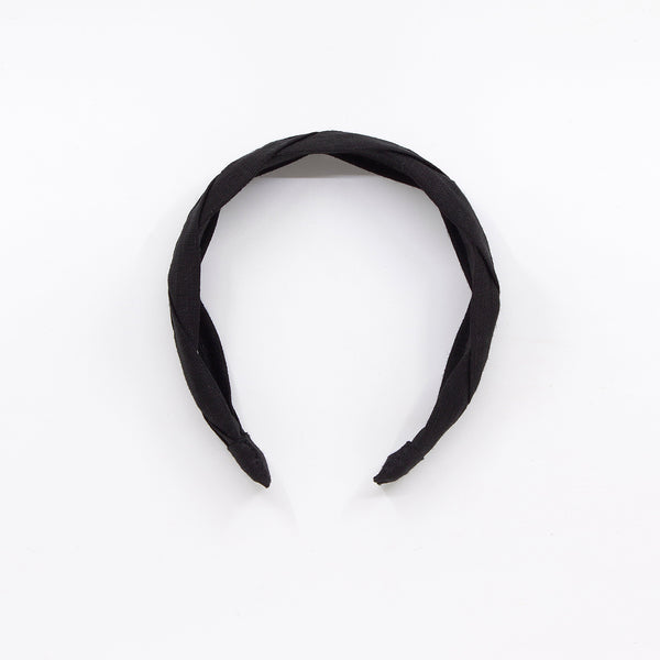 black braided headband on a white background