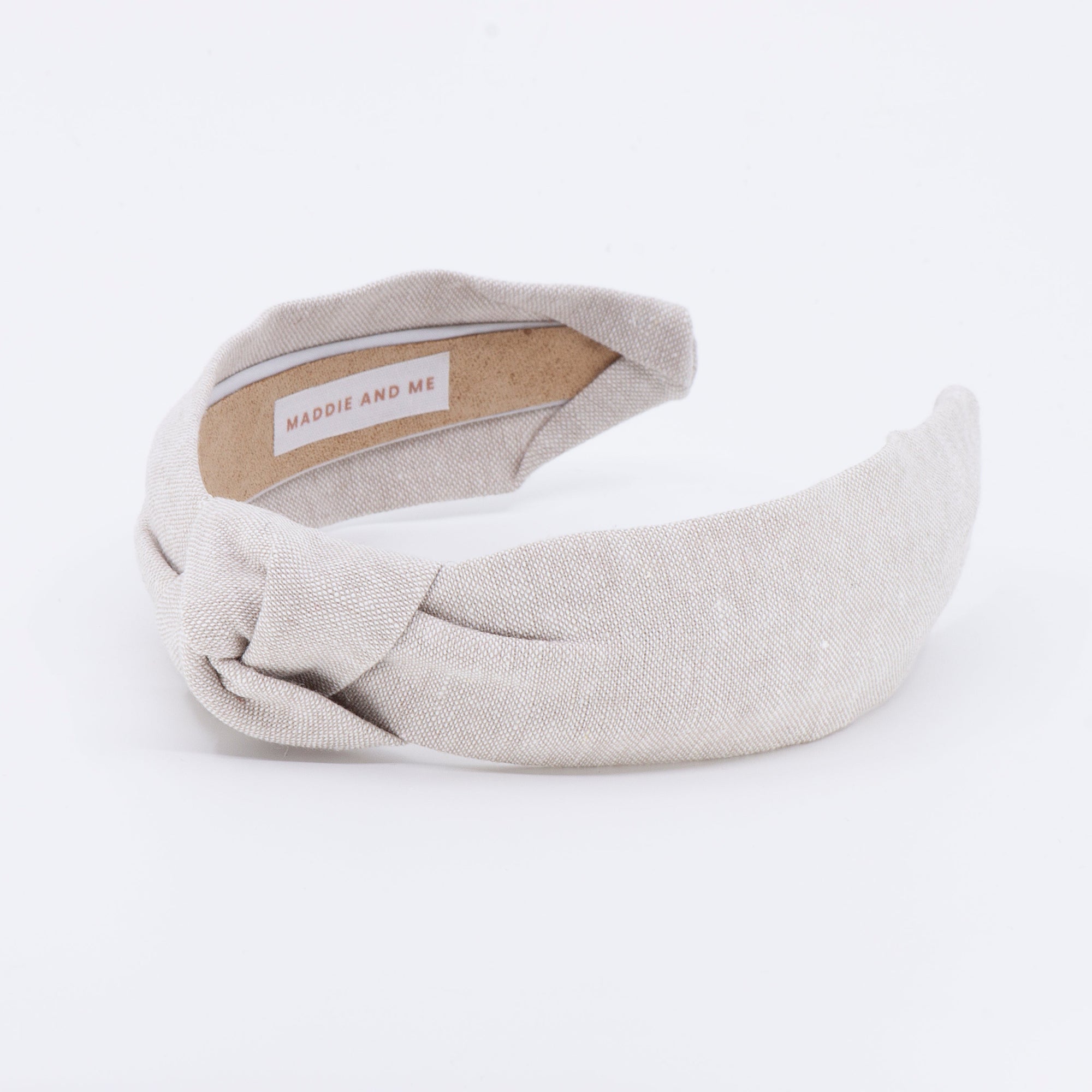 linen knotted headband on a white background