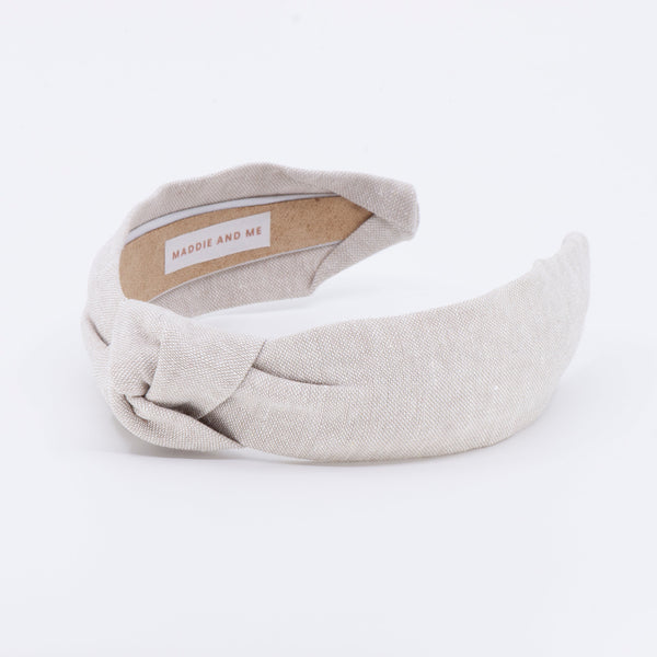 linen knotted headband on a white background
