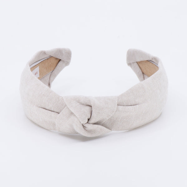 linen knotted headband on a white background