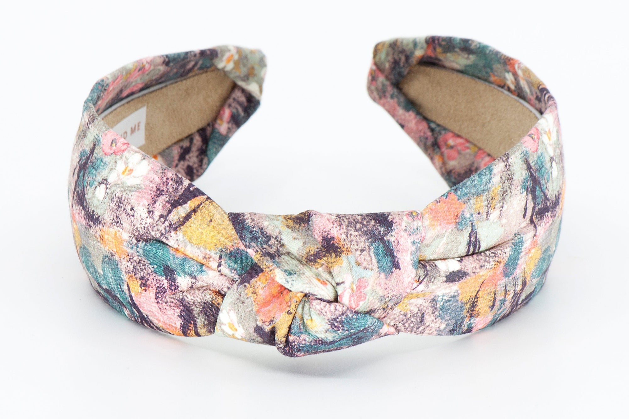 Floral patterned headband on a white background