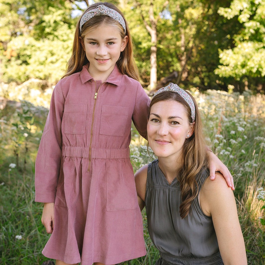 Mother and daughter wearing floral headband