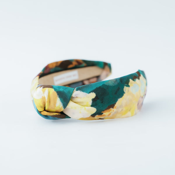multicolor floral knotted headband on a white background