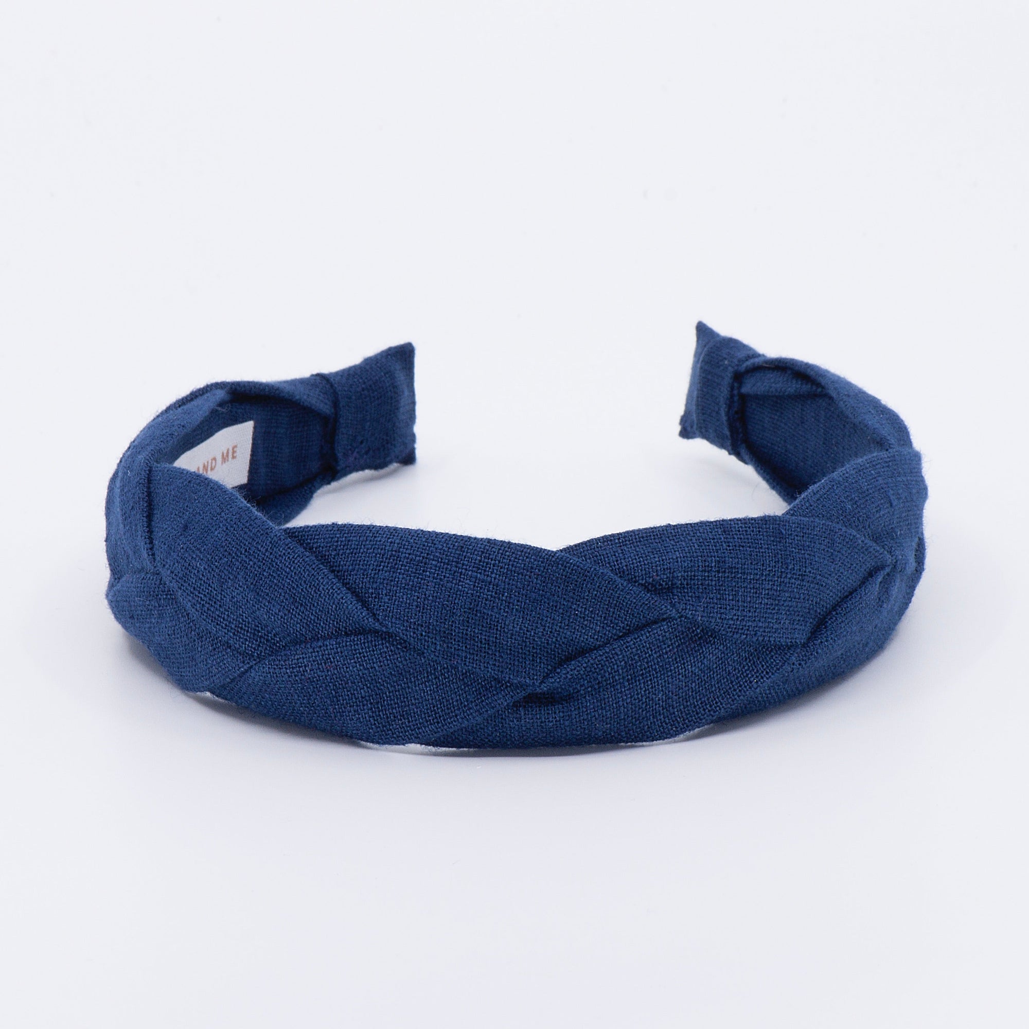 navy braided headband on a white background