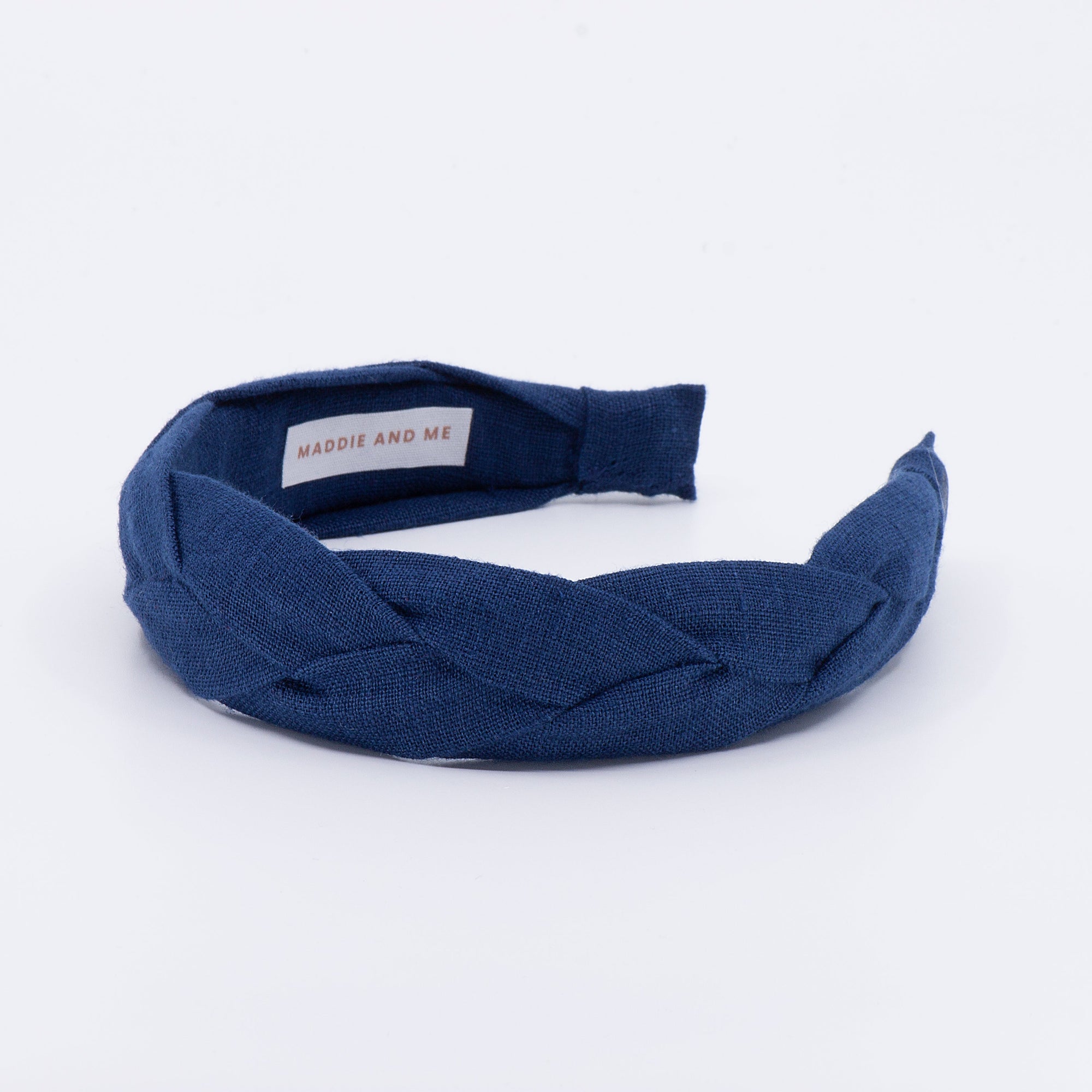 navy braided headband on a white background