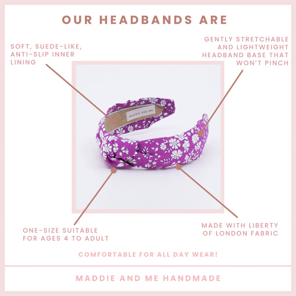 Bright pink floral headband on a white background