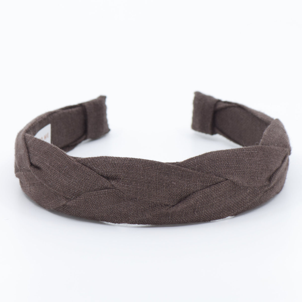 A dark brown braided fabric headband shown on a plain white background.