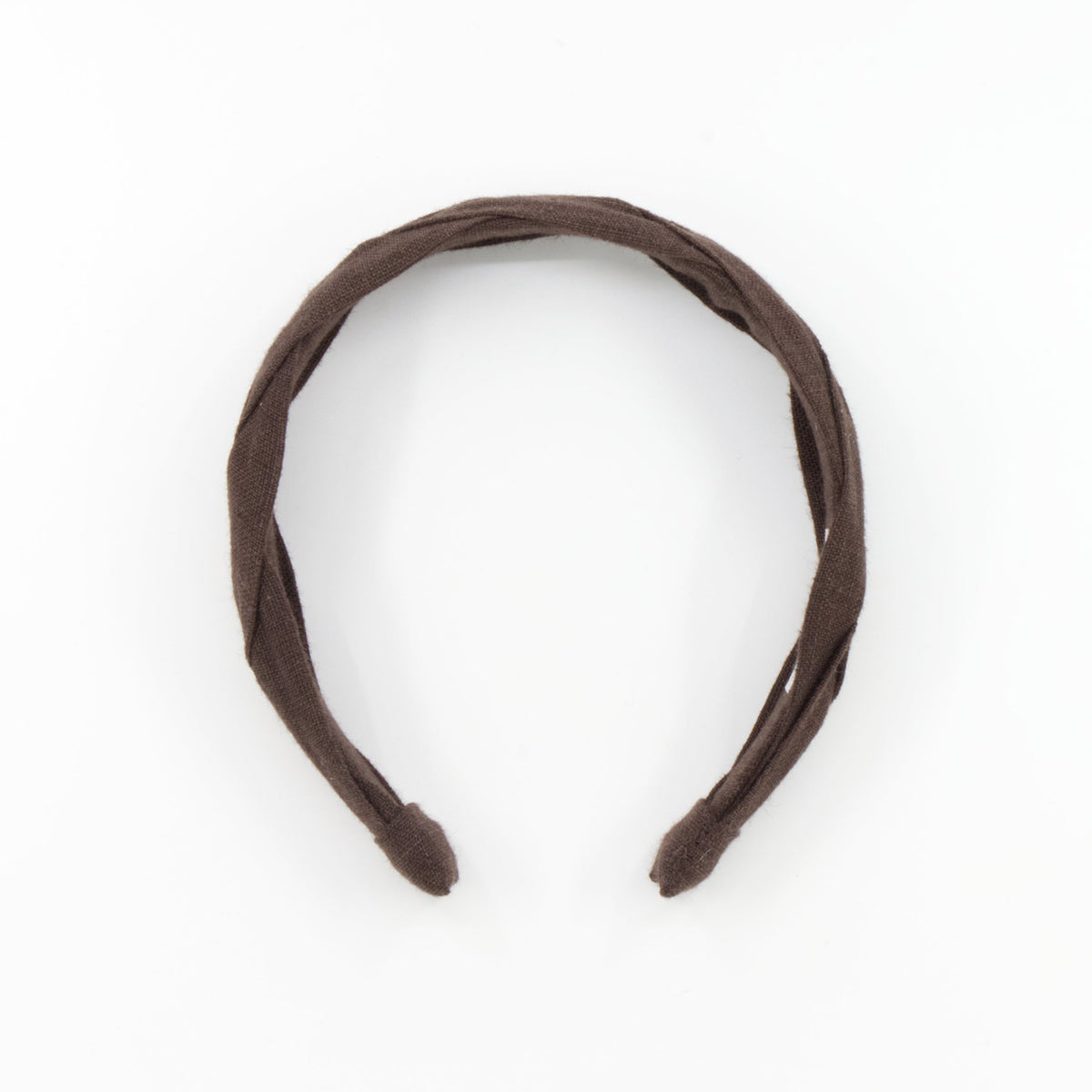 A dark brown braided fabric headband on a solid white background.