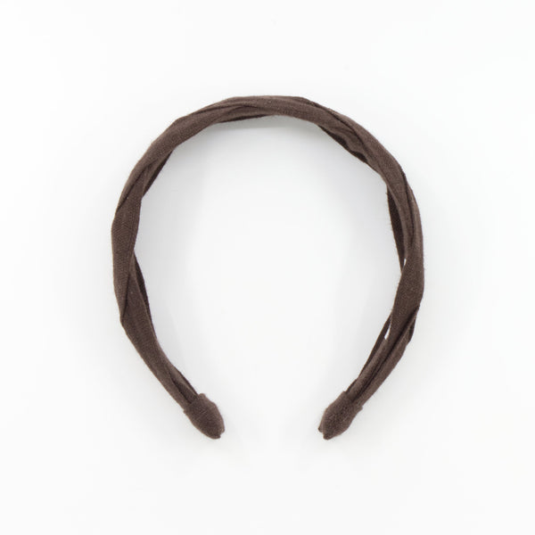 A dark brown braided fabric headband on a solid white background.