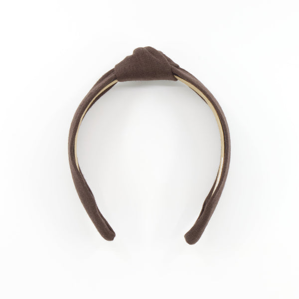 A dark brown fabric headband with a knot at the top, displayed on a clean white background.