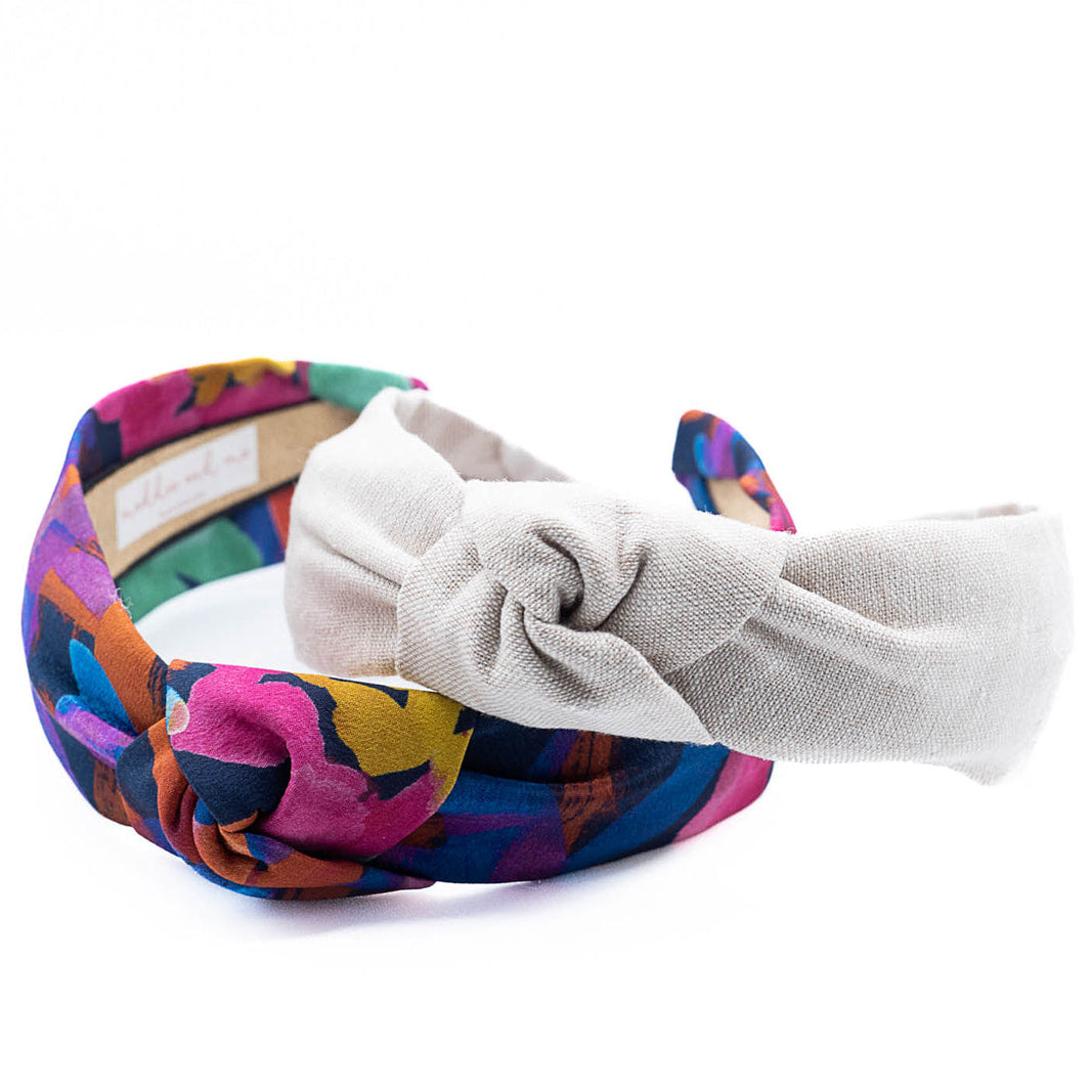 multicolor patterned  and plain  colored  headband on a white background