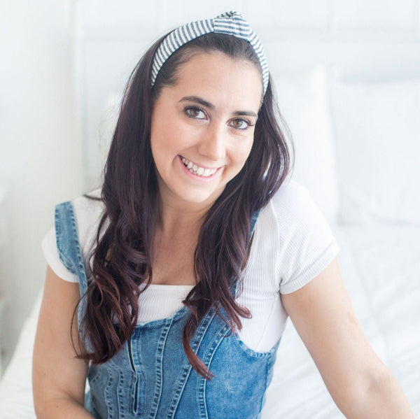 woman wearing a stripe knotted headband