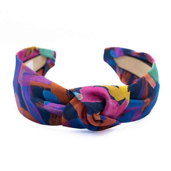 multicolor patterned headband on a white background