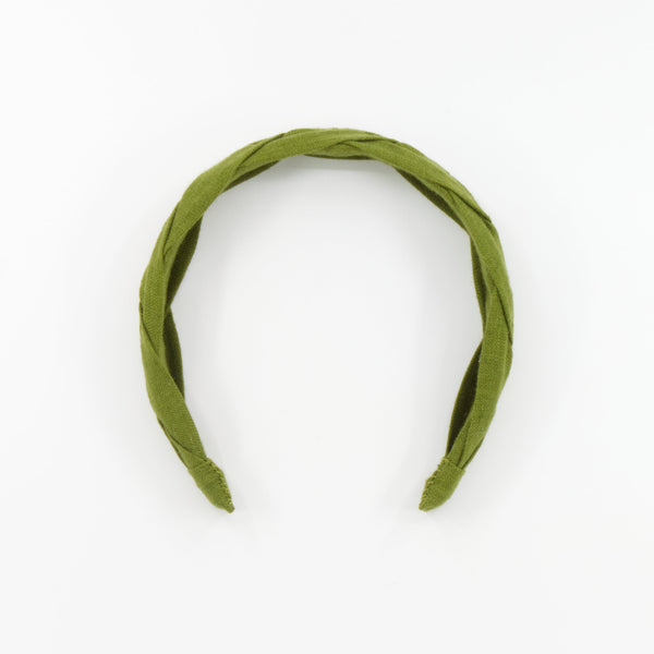 An olive green braided fabric headband photographed on a clean white background.