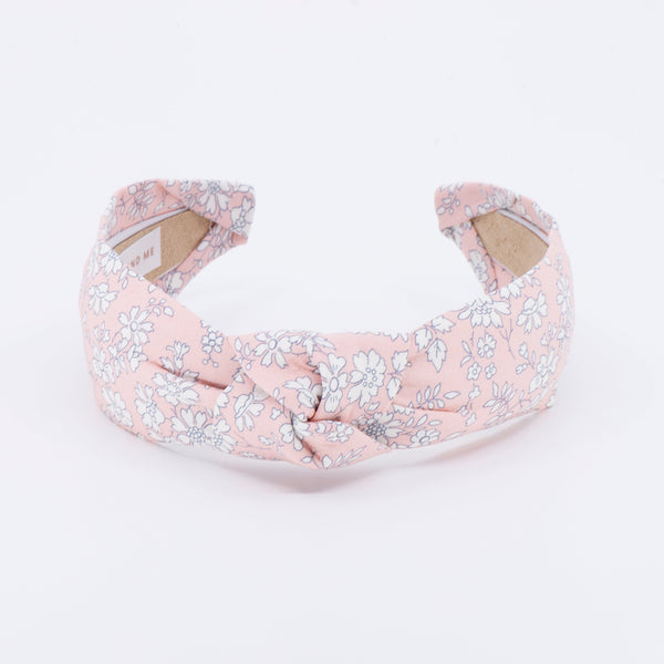 peach floral patterned headband on a white background