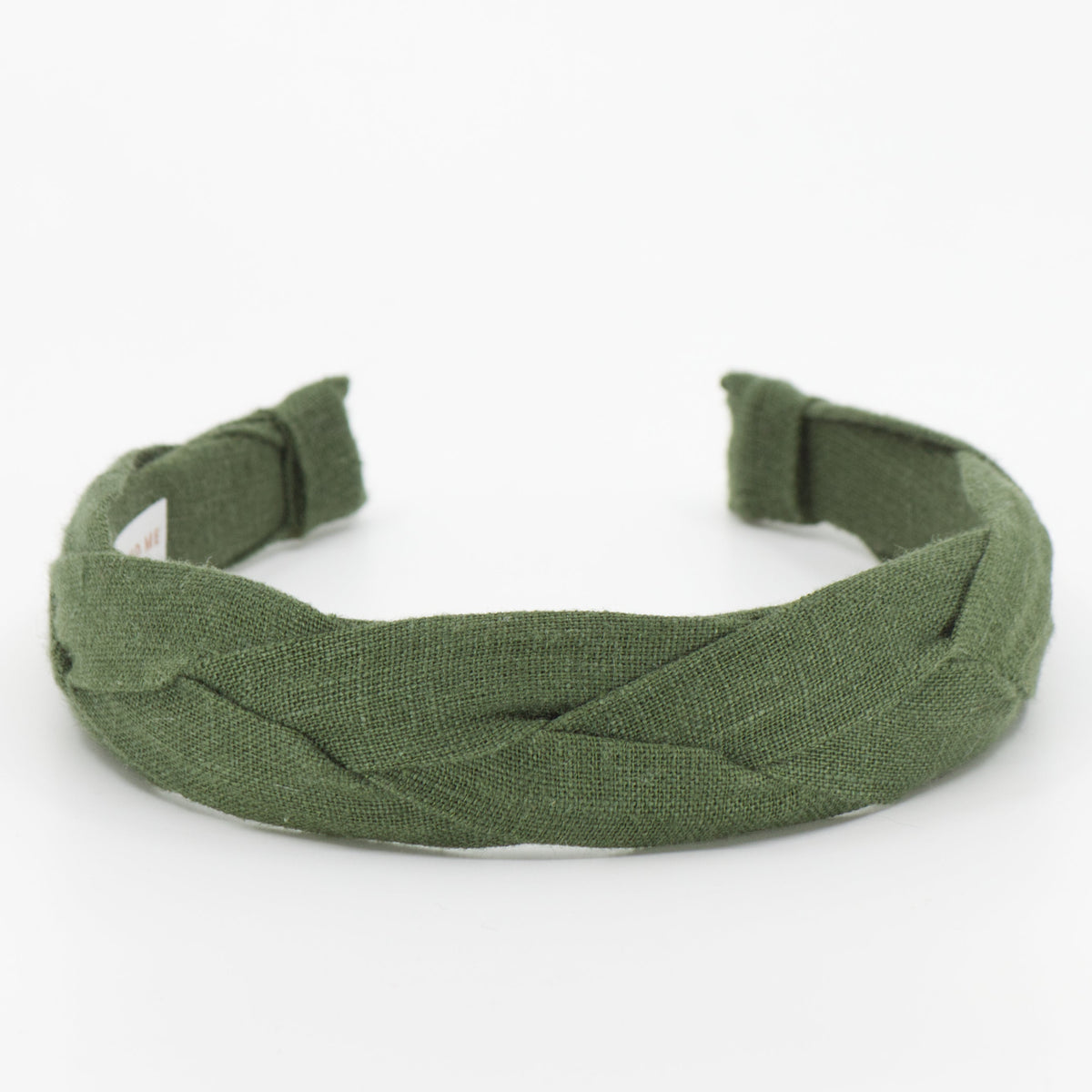 A pine green braided fabric headband shown on a plain white background.