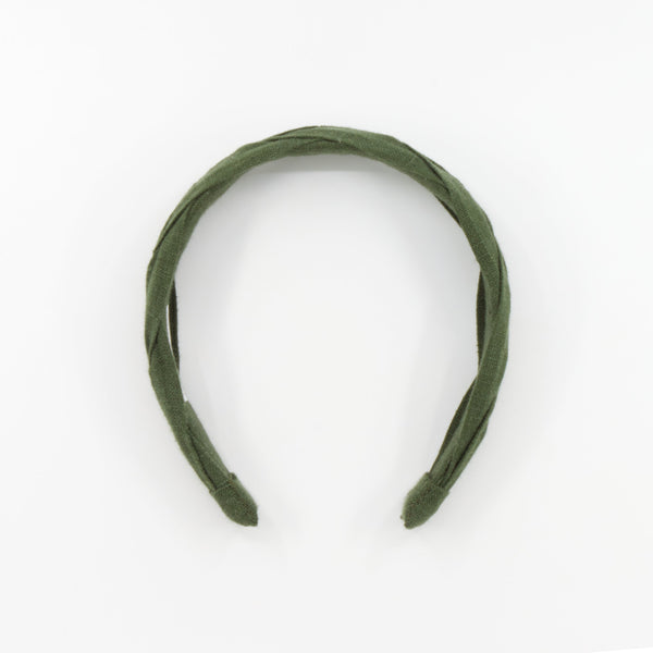 An olive green braided fabric headband photographed on a clean white background.