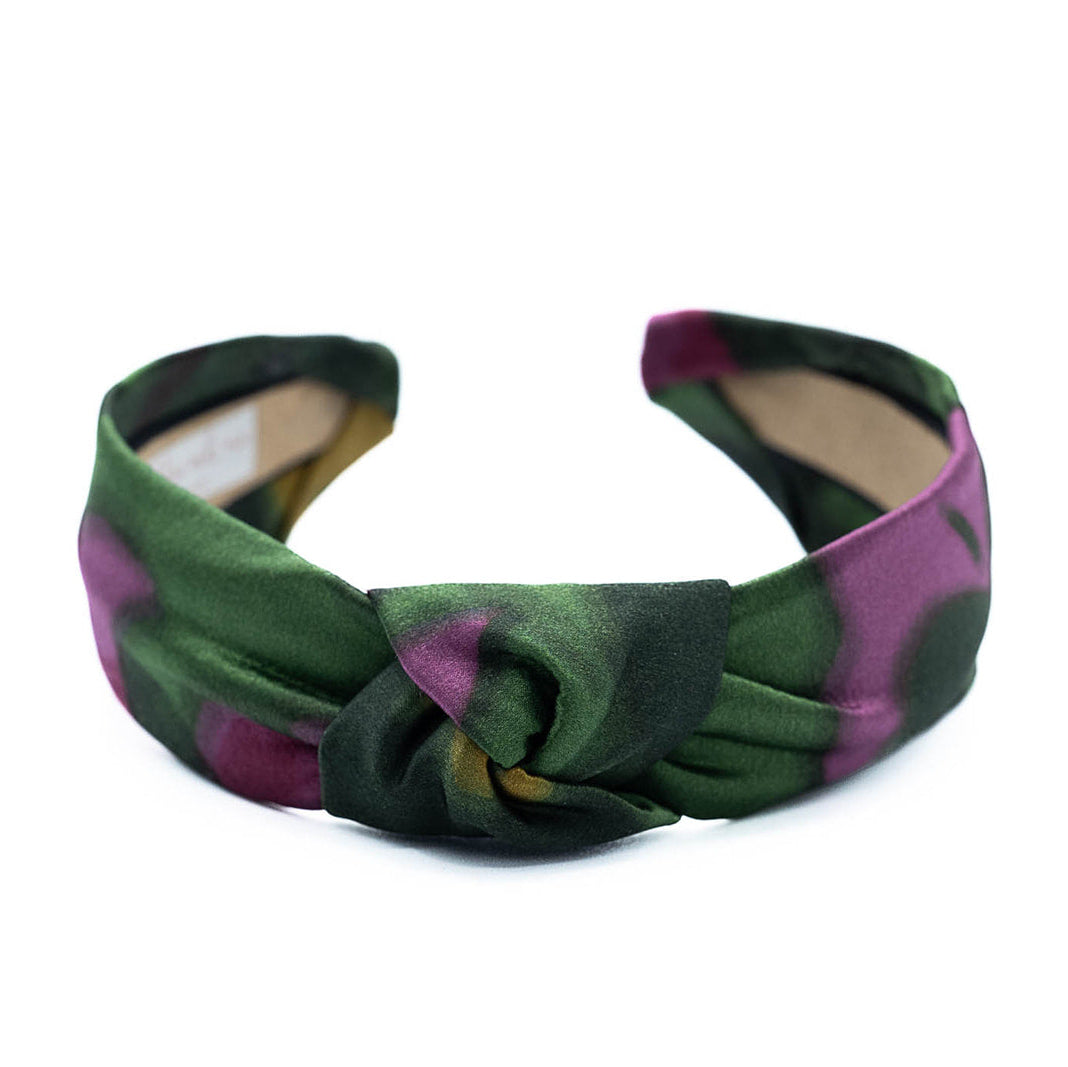 Silk knotted headband on a white background
