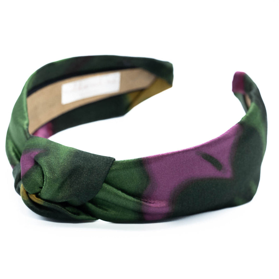 Silk knotted headband on a white background