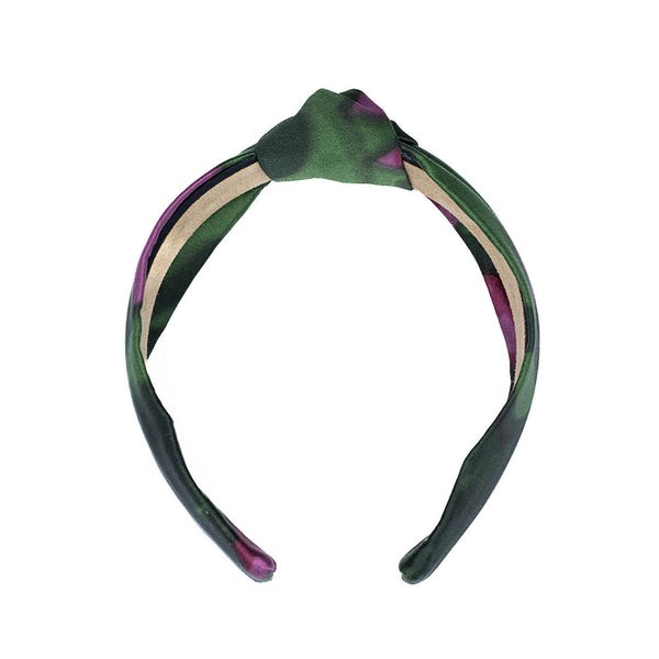 Silk knotted headband on a white background