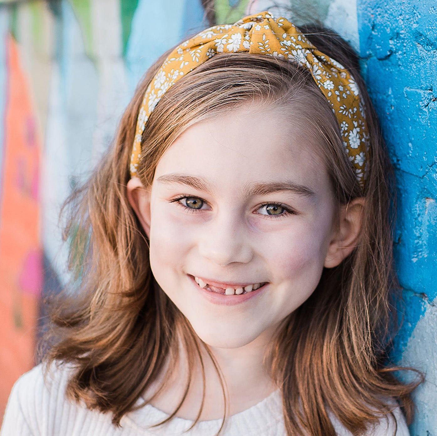 Girl wearing floral knotted headband outdoor