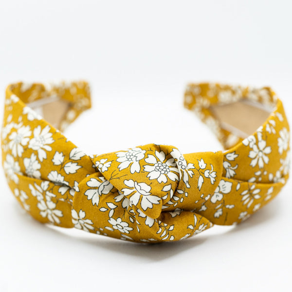 mustard floral headband on a white background