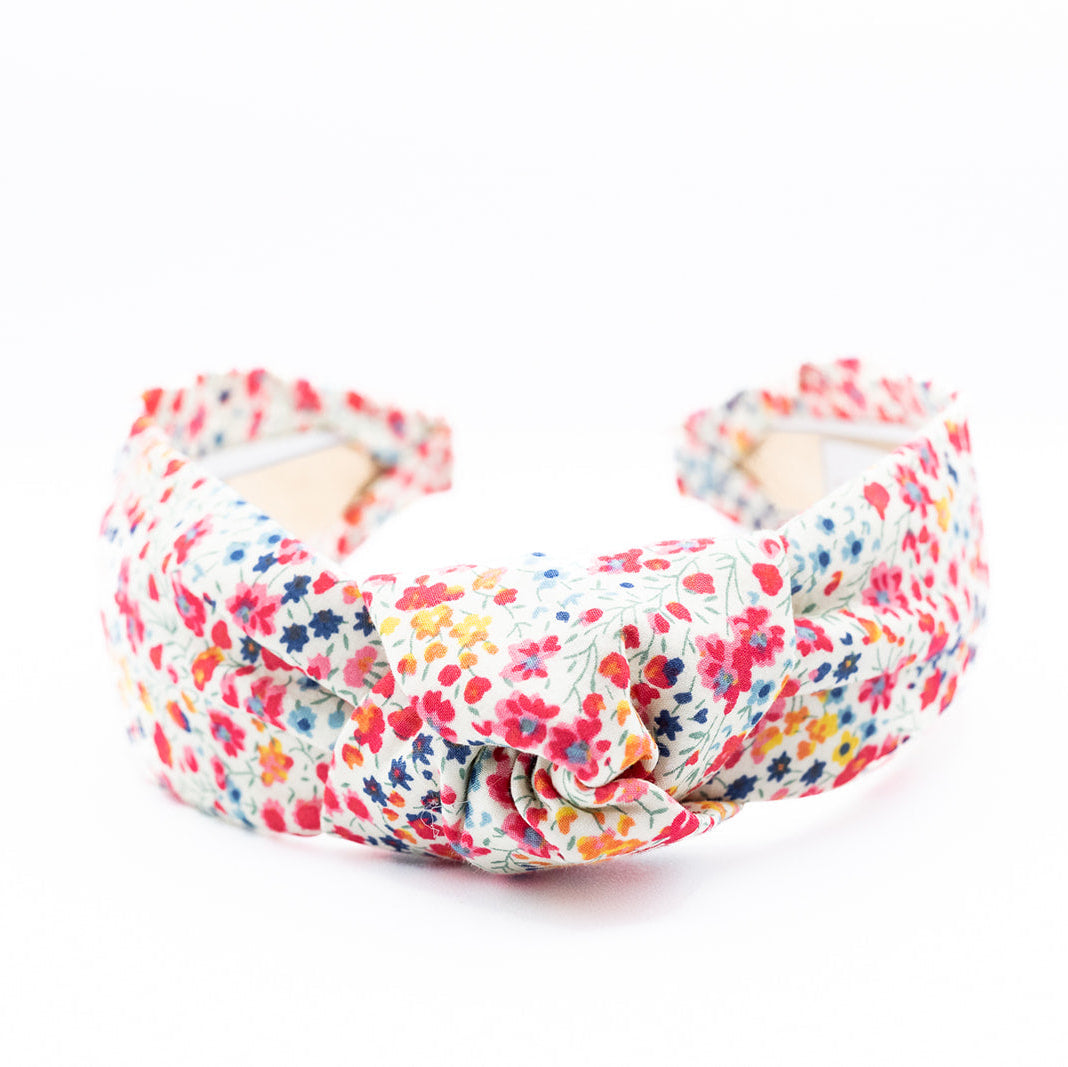 floral knotted headband on a white background
