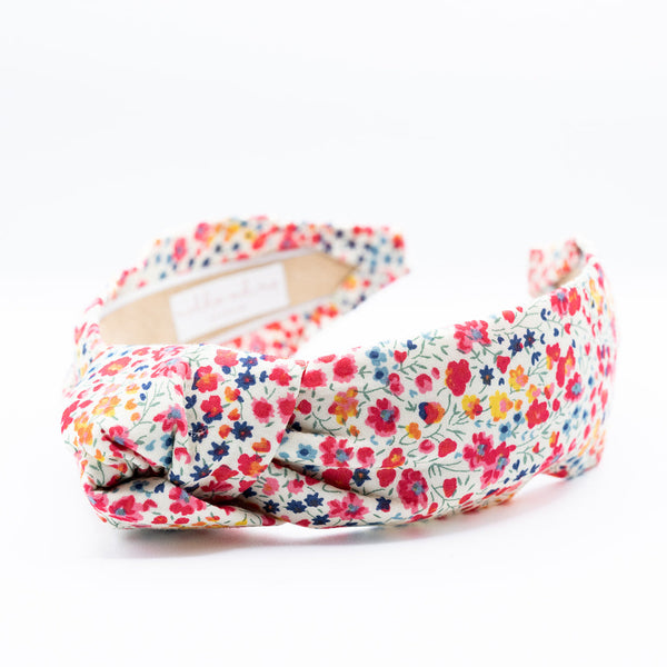 floral knotted headband on a white background